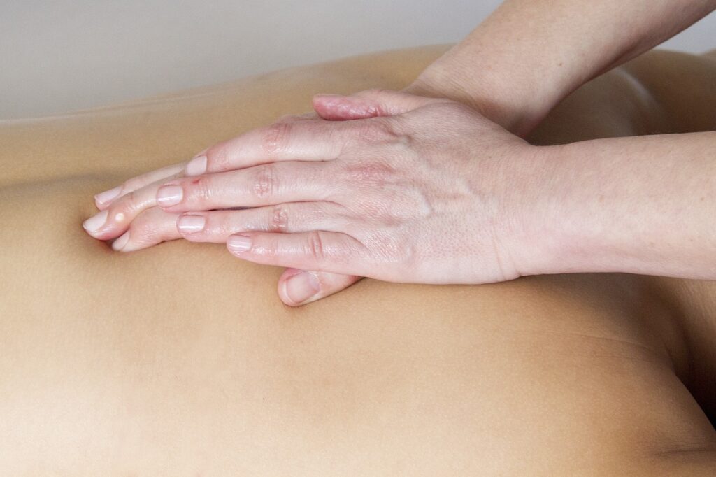 Experienced therapist providing a relaxing full body massage at Athira Spa in Altrincham.